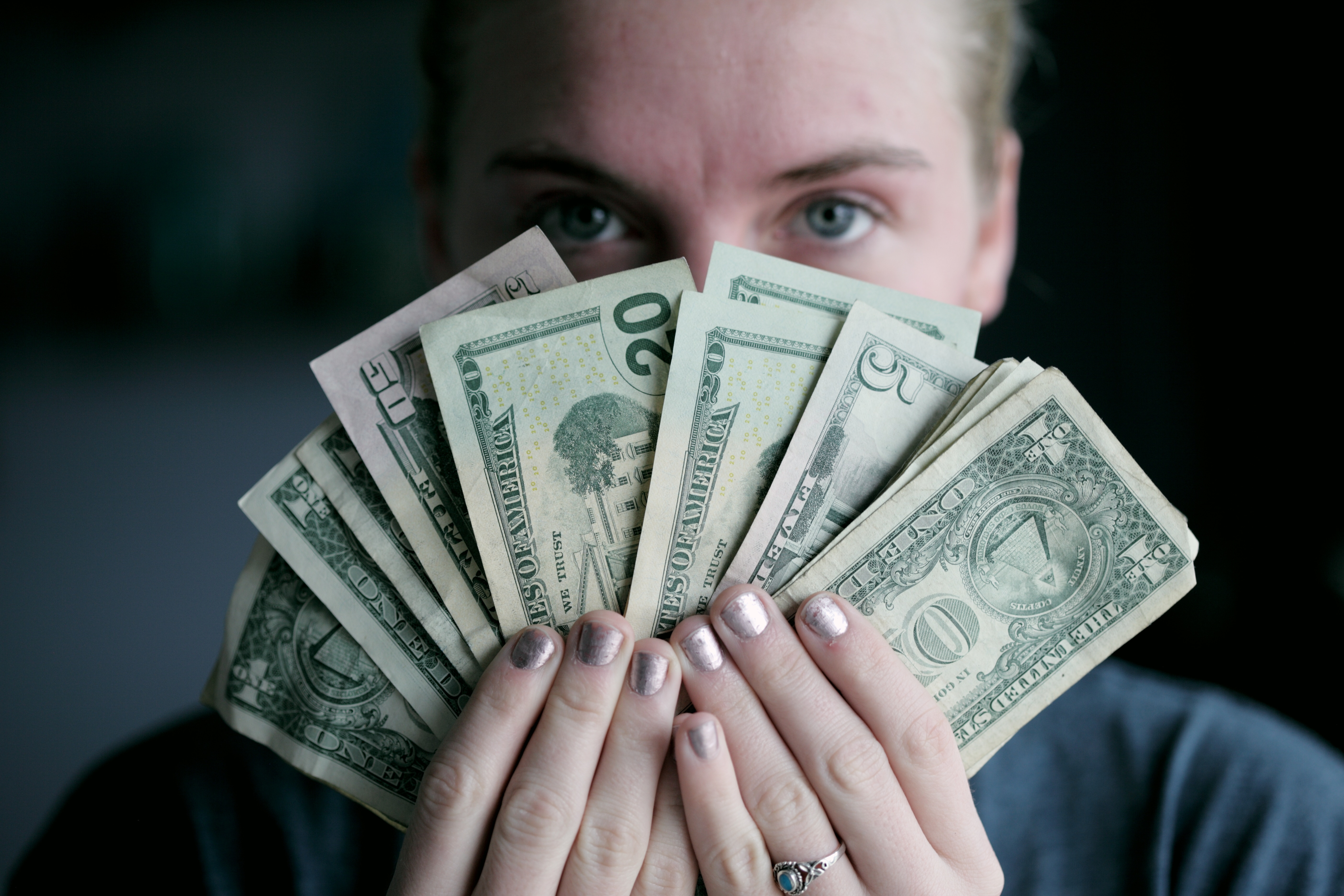 woman holding dollars